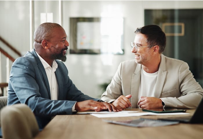 Account manager and customer in meeting room
